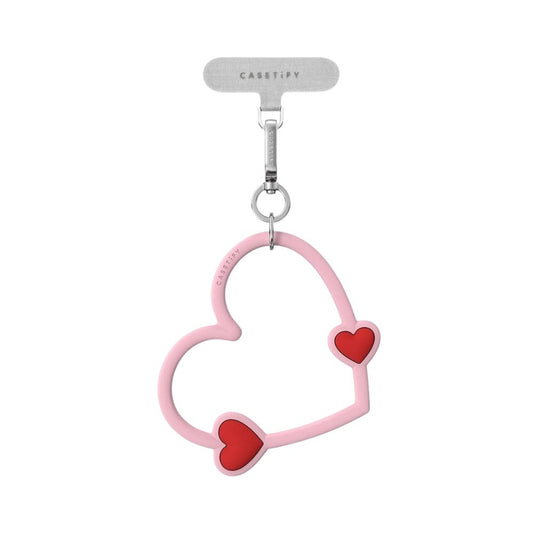 Accesorio Casetify strap de mano corazon rosado