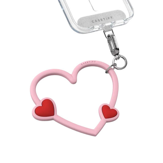 Accesorio Casetify strap de mano corazon rosado