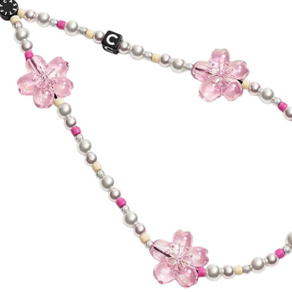 Accesorio Casetify strap de mano Sakura Pearl Pink